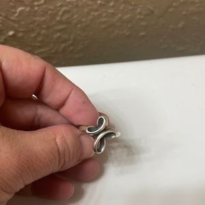 James Avery ring.  It’s called “Eternal Ribbon Cross” ring